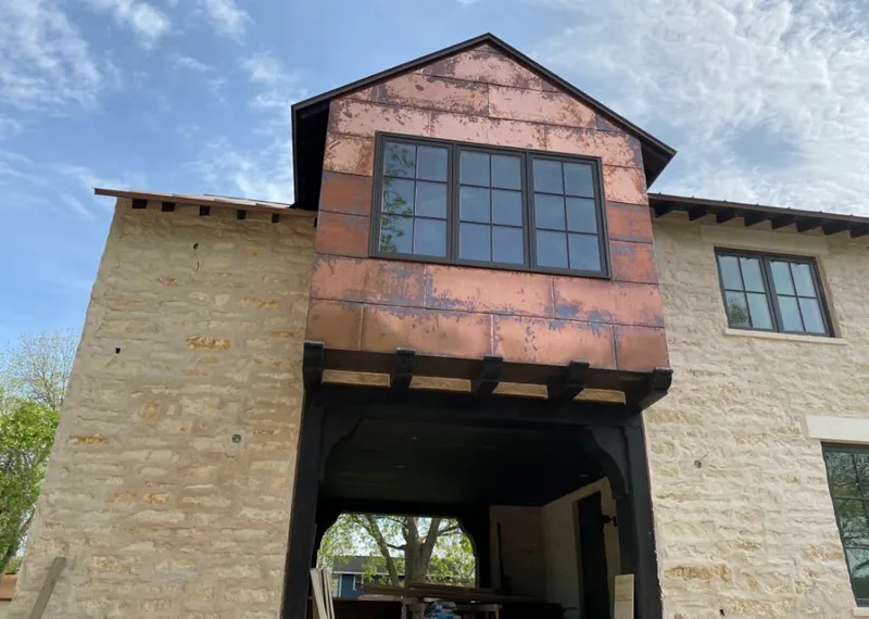 Copper metal panel facade on a stone building for Metal Roof Coating in Napa