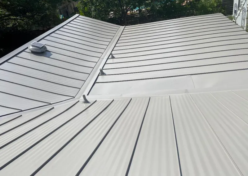 Solar attic fan installed on a metal roof for Roof Ventilation in Napa